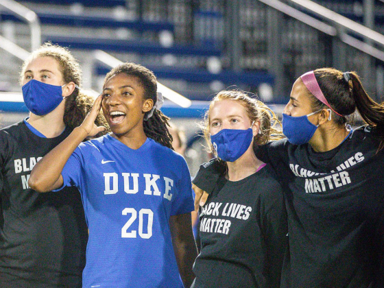 four Duke women soccer players - three wearing Black Lives Matter shirts 